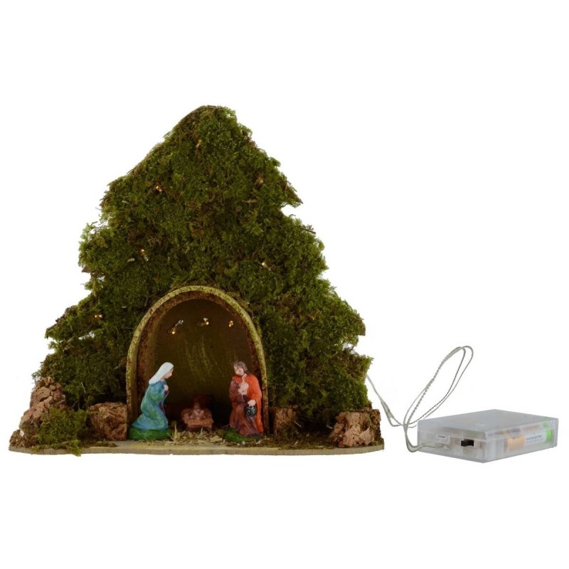 Tree with hut and Nativity illuminated with piled with