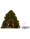 Tree with hut and Nativity illuminated with piled with