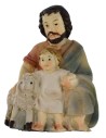 Shepherd sitting with child and lamb series 9 cm in resin