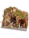 Classic illuminated nativity scene with grotto and mill running