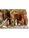 Classic illuminated nativity scene with grotto and mill running