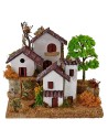 Casitas para belén en dos niveles con árbol de 15x19x14 cm de altura.