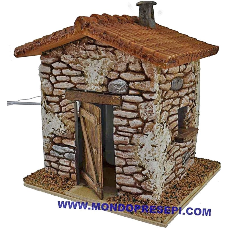 Casa de piedra con humo de 15x12x19 cm de altura. Mundo