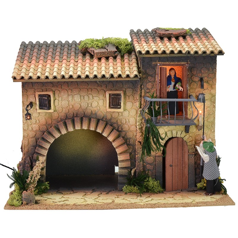 Illuminated house with moving lamplighter 12 cm and woman who