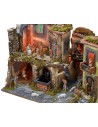 Nativity scene complete with statues with illuminated village, oven and