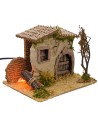 Casita rústica con fuego funcional de 19x15x14,5 cm de altura.