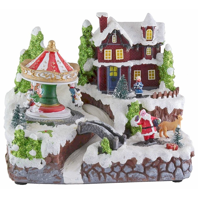 Christmas village with battery-operated carousel with lights