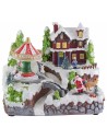 Christmas village with battery-operated carousel with lights