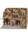 Illuminated nativity scene with caves and working fountain