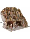 Illuminated nativity scene with caves and working fountain