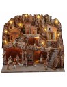 Illuminated nativity scene with caves and working fountain