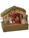 Illuminated hut with Nativity and moving bagpipe player cm