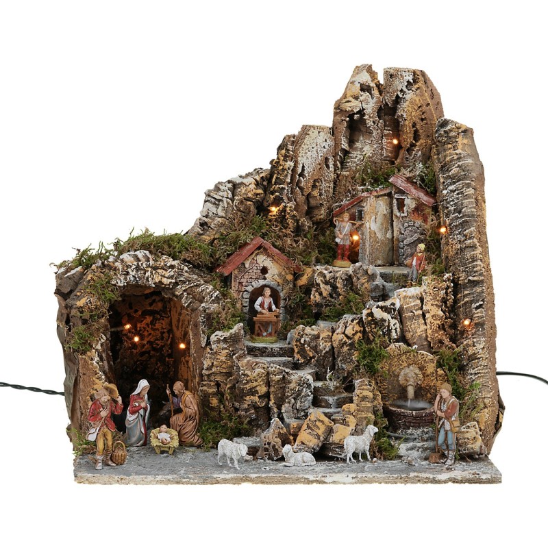 Presepe illuminato con fontana funzionante e completo di statue