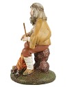 Shepherd with staff sitting in front of the fire in painted resin