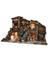 Illuminated nativity scene complete with statues, waterfall, fountain, and