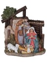 Nativity in resin with Saint Joseph, Mary kneeling, Baby Jesus in the manger, and a little sheep.