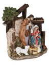 Nativity in resin with Saint Joseph, Mary kneeling, Baby Jesus in the manger, and a little sheep.