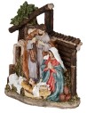 Nativity in resin with Saint Joseph, Mary kneeling, Baby Jesus in the manger, and a little sheep.