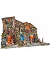 Illuminated nativity scene complete with statues, waterfall, fountain, and