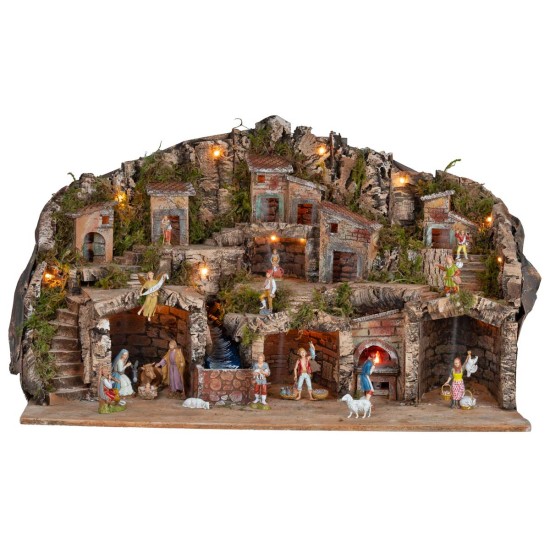 Presepe illuminato con grotte, casette, ruscello e forno